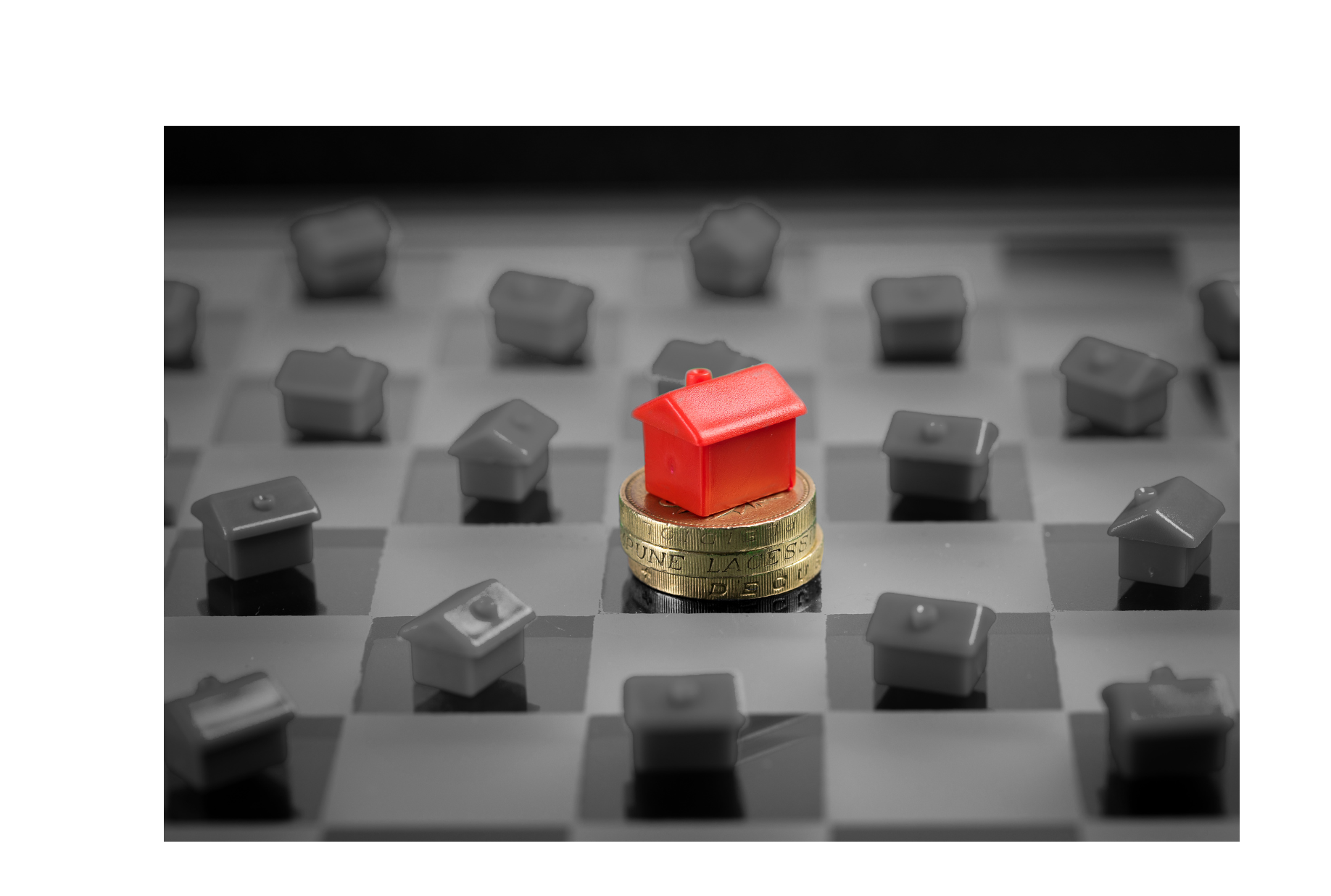 An image showing a person holding a house-shaped puzzle with the words what is holding offers in real estate written on it, representing buyer strategies.